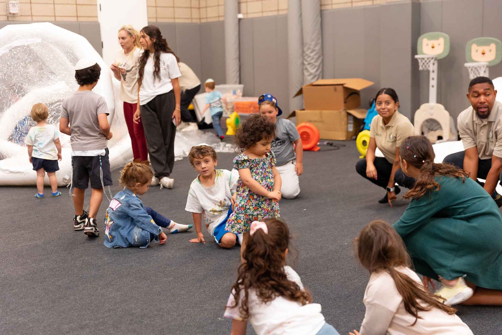 LA Sports World coaches engaging children during an indoor program