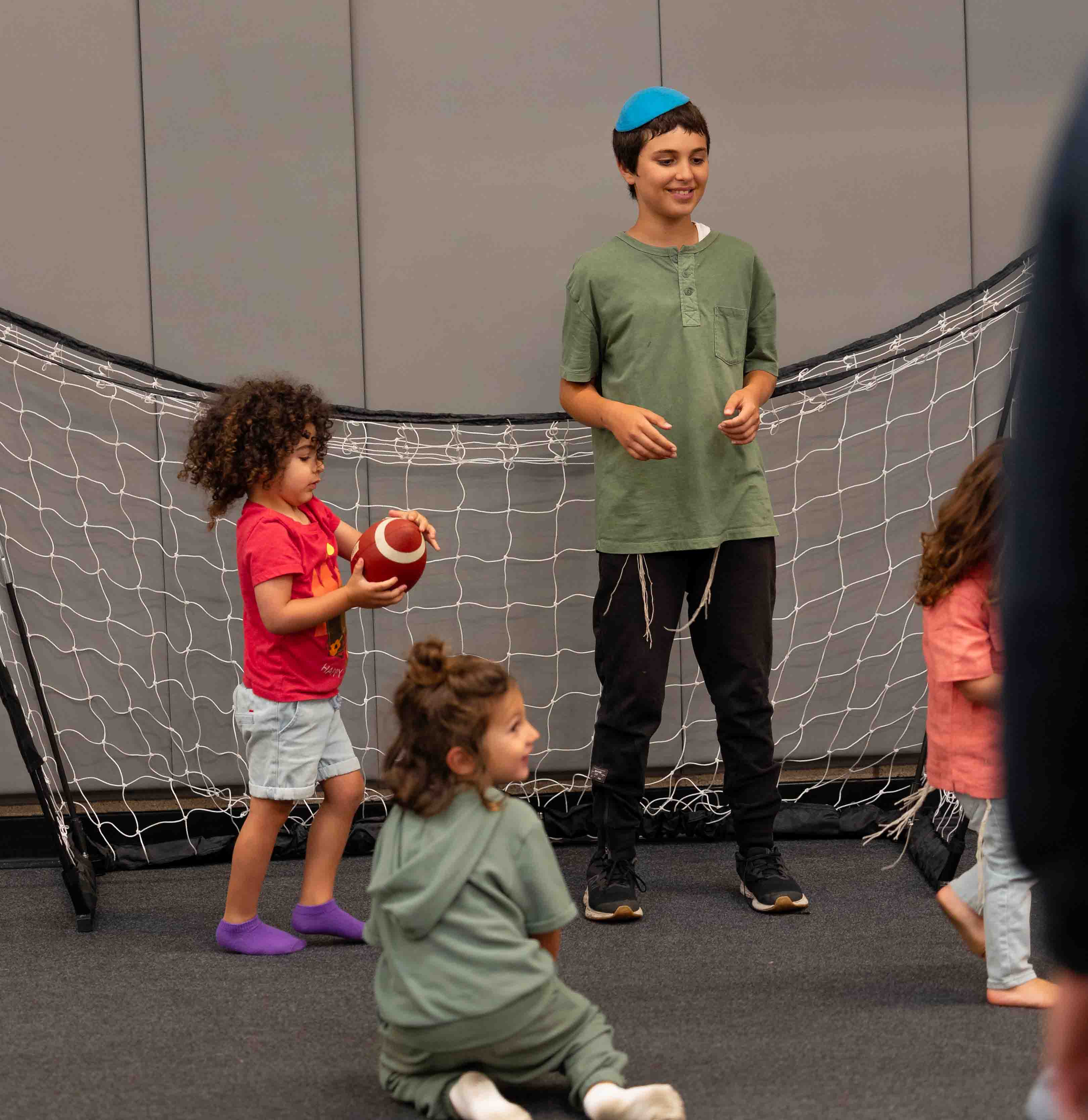 Children taking part in an indoor LA Sports World sports activity